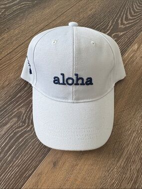 NWT White 'aloha' Embroidered Cap- Navy Lettering & Velcro back adjuster.